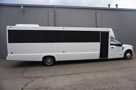 white party bus exterior for large groups of people