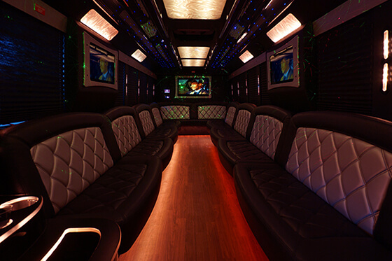 luxury party bus with flat screen TVs, leather seats and wet bars